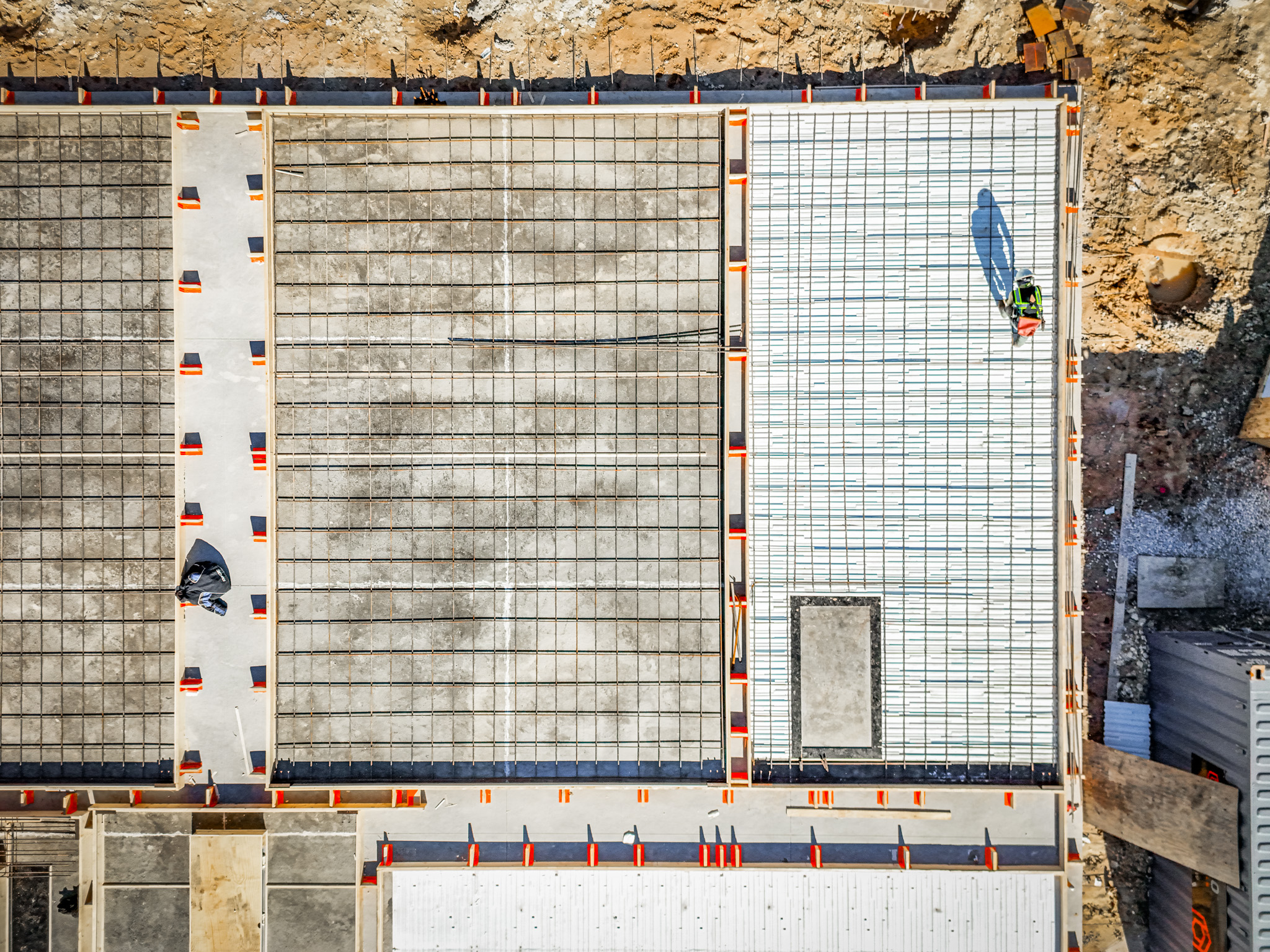 Aerial view of a rebar foundation grid at a commercial design-build construction site in Dallas-Fort Worth
